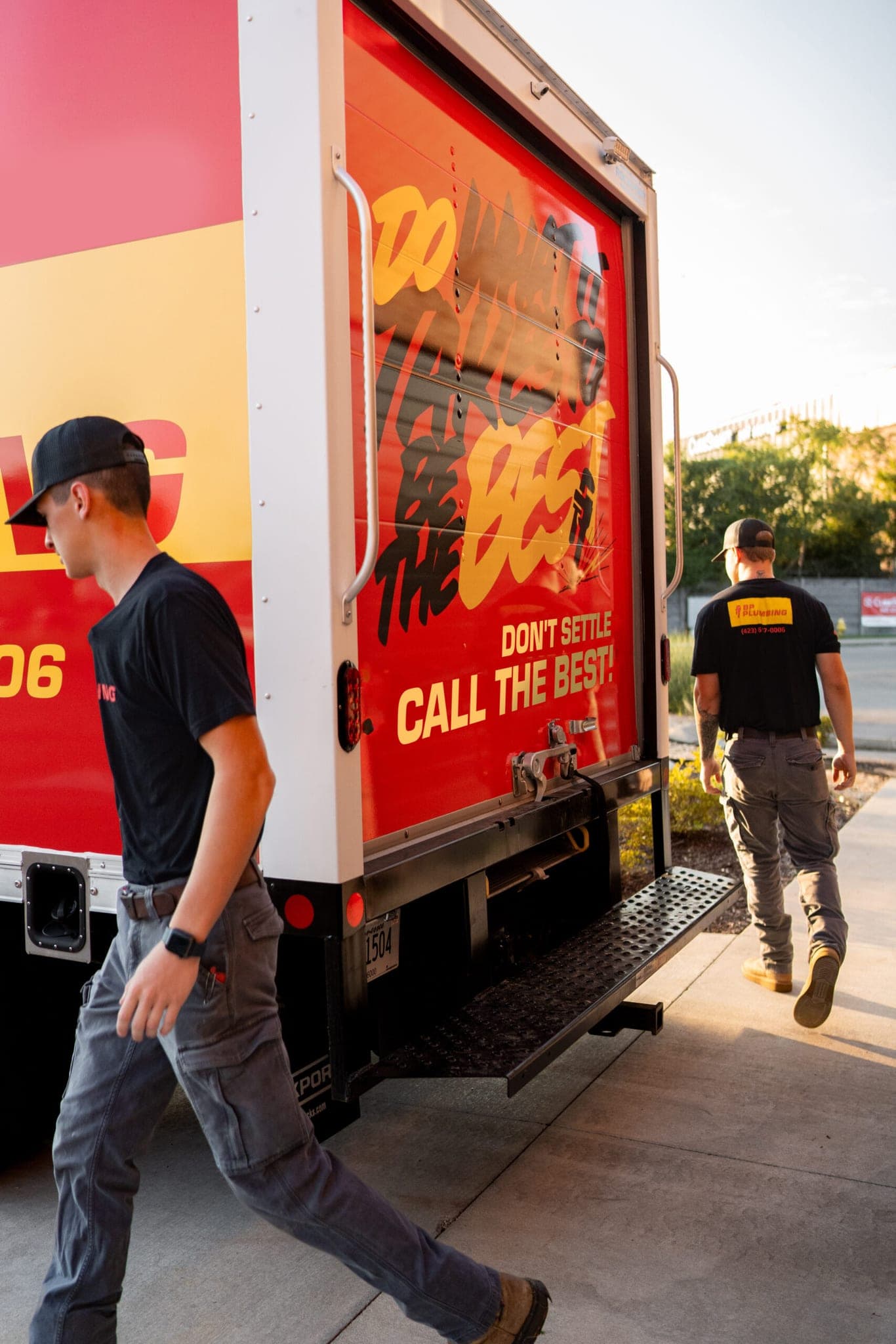 Two BP Plumbing technicians working at the company truck in Chattanooga